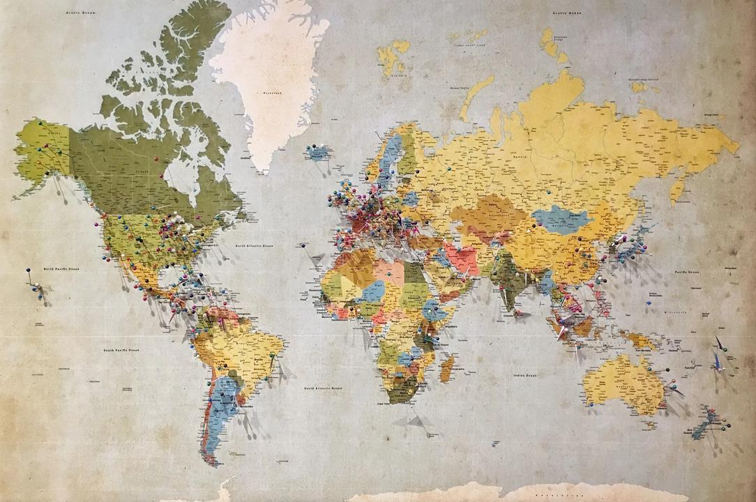 World map with pins (Andrew Stutesman, via Unsplash)