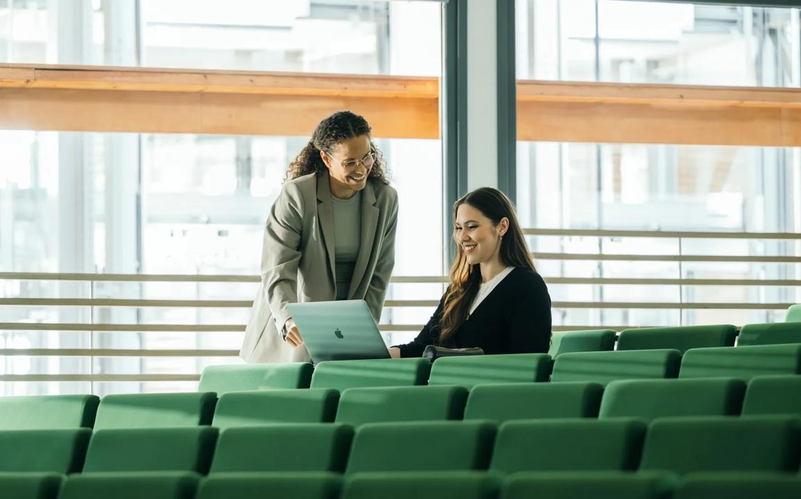 Student and professor in an auditorium