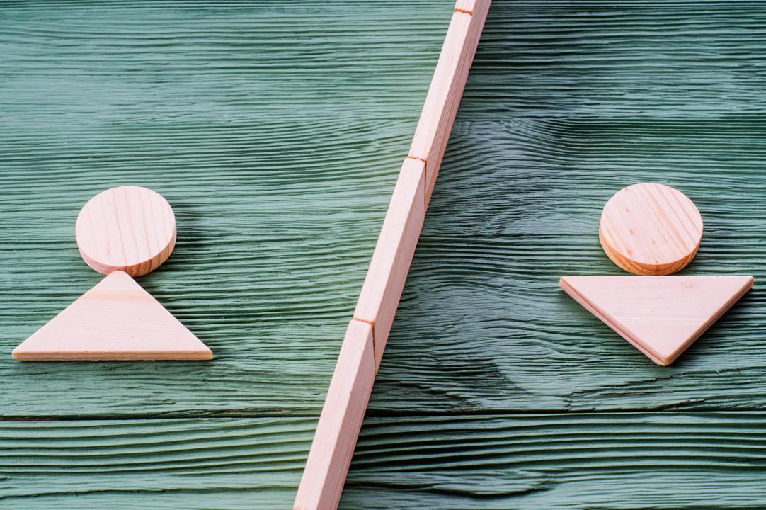Male and female sign in wood